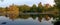 Panoramic Colorful Autumn Foliage Reflected on a Lake with a Glass-like Mirror Water Surface on Cape Cod