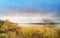 Panoramic colorful view of lake on sunset in spring