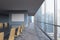 Panoramic conference room in modern office in Singapore. Brown chairs and a black table.