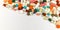 Panoramic  different colorful medication and pills from above on a white background. Medicines for the disease. Pharmaceutical