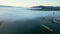 Panoramic drone view of a barge floating in dense fog on the Rhone River in the morning. In the town of Le Pouzin in France.