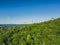 Panoramic drone view of a modern gondola lift with a lookout tower over the Solina water dam