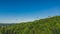 Panoramic drone view of a modern gondola lift with a lookout tower over the Solina water dam