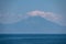 Panoramic early morning view of cloud covered holy Mount Athos from Fava sand beach, Vourvourou, peninsula Sithonia, Greece