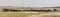 Panoramic of entire elephant herd crossing river
