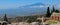 Panoramic of Etna volcano from the remains of the ancient Greek theater of Taormina   Sicily  Italy