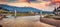 Panoramic evening cityscape of Berat town with walking bridge.