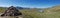 Panoramic of the French Alps : cairn and lake