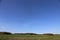 Panoramic green field and blue sky and forest. Belarus