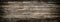 Panoramic grey grunge background of old wooden boards with vignette.