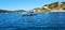 Panoramic hills, boat, rocks in Elba island, Italy, landscape