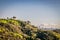 Panoramic hilltop view of downtown Los Angeles and Griffith Park Observatory