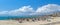 Panoramic image beach with parasols sunbeds of El Arenal resort town, Majorca, Spain