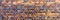 Panoramic image of brick wall with different colors