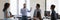 Panoramic image diverse employees take part in group meeting