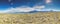 Panoramic image over the Argentine steppe with view of Patagonia mountain range with Cerro Torre and Mount Fitz Roy