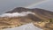 Panoramic Image of Rainbow with mountain range near Aoraki Mount Cook and the road leading to Mount Cook in New zealand