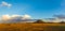 Panoramic image of the Sonoran Desert of Arizona during sunset with distant rain