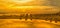 Panoramic image of sunrise on the beach in Mallorca.