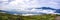 Panoramic image of the views of the Sierra de Guadarrama with its clouds from the top of a mountain peak