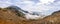 Panoramic image of the views of the Sierra de Guadarrama with its clouds from the top of a mountain peak