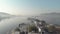 Panoramic of Lake Pichola and Taj Lake Palace from Ambrai Ghat in Udaipur, Rajasthan, India - Aerial Low angle Orbit shot