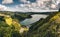 Panoramic landscape with aerial view on beautiful blue green crater lake Lagoa das Furnas and village Furnas with