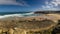 Panoramic landscape of the Atlantic ocean beach of Praia das Macas. View of great waves of a powerful ocean break into foam and su