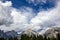 Panoramic landscape of the Dolomites on the Italian side, on the left the three peaks of Lovereto.