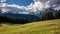 Panoramic landscape of the Dolomites on the Italian side, on the left the three peaks of Lovereto.