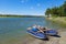 Panoramic landscape of the Kitoy river, Irkutsk region, Russia. Catamaran ready for rafting on water.