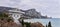 Panoramic landscape with large astronomical radio telescope on the seashore