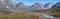 Panoramic landscape of mountains and meltwater river at Camp Frieda on the Disko Bay coast, Greenland