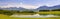 Panoramic landscape in region Allgaeu with lake and alps mountains