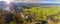 Panoramic landscape in region Allgaeu with mountain range, lake and maedow