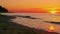 Panoramic landscape rock silhouette at orange sunrise morning. Ocean wave
