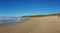 Panoramic landscape of sandy beach and ocean waves