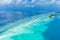 Panoramic landscape seascape aerial view over a Maldives Male Atoll islands. White sandy beach seen from above
