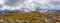 Panoramic landscape of snow covered peaks of Australian Alps under beautiful clouds. New South Wales, Australia