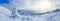 Panoramic landscape of a snowy forest in the mountains on a sunny winter day. Ukrainian Carpathians, near Mount Petros