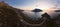 Panoramic landscape of Telendos island in distance and part of Kalymnos island at sunset