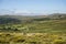 Panoramic landscape view across Dartmoor National Park in Summer with wide views of several tors and valleys