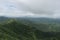 Panoramic landscape view of beautiful lush green Sahyadri mountains in monsoon season as seen from Sinhgad fort located in Pune,