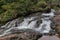 Panoramic landscape view of beautiful stream of water flowing through nature in Thoseghar village, Satara, Maharashtra, India