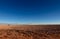 Panoramic landscape view near â€œOjos del Salarâ€ in the Atacama Desert, Chile, depicting tire tracks