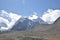 Panoramic landscape view of snowcapped great Himalayas mountains seen from Gurudongmar Lake, a famous tourist attraction in Mangan