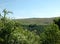 Panoramic landscape view between spring trees in the colden valley above hardcastle crags in west yorkshire