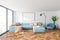Panoramic living room with blue sofa and poster