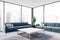 Panoramic living room corner with blue sofas