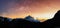 Panoramic Matterhorn mountain in sunrise with starry sky in dawn